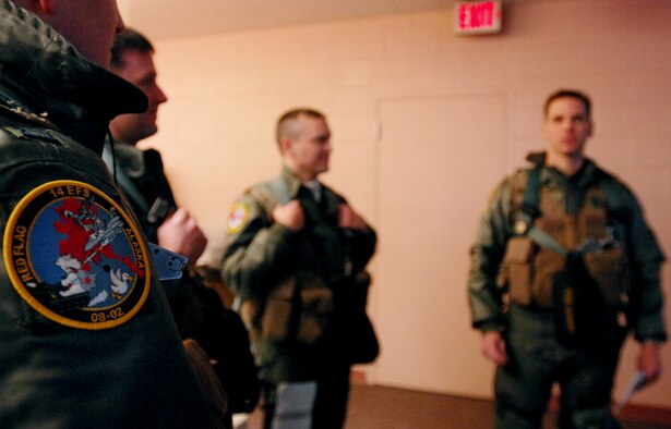F-16 Fighting Falcon fighter pilots from the 14th Fighter Squadron, Misawa Air Base Japan gathers together to discuss flying formations and any other pertinent information prior to their flying mission over the Pacific Alaska Range Complex on April 7, 2008 during Red Flag-Alaska 08-02 exercise at Eielson Air Force Base, Alaska. Red Flag-Alaska is a series of Pacific Air Forces field training exercises for U.S Forces and allies that provide joint offensive counter-air, indirection, close air support, and large force employment training in a simulated combat environment.(U.S Air Force Photo by Technical Sgt. Eric T. Sheler)