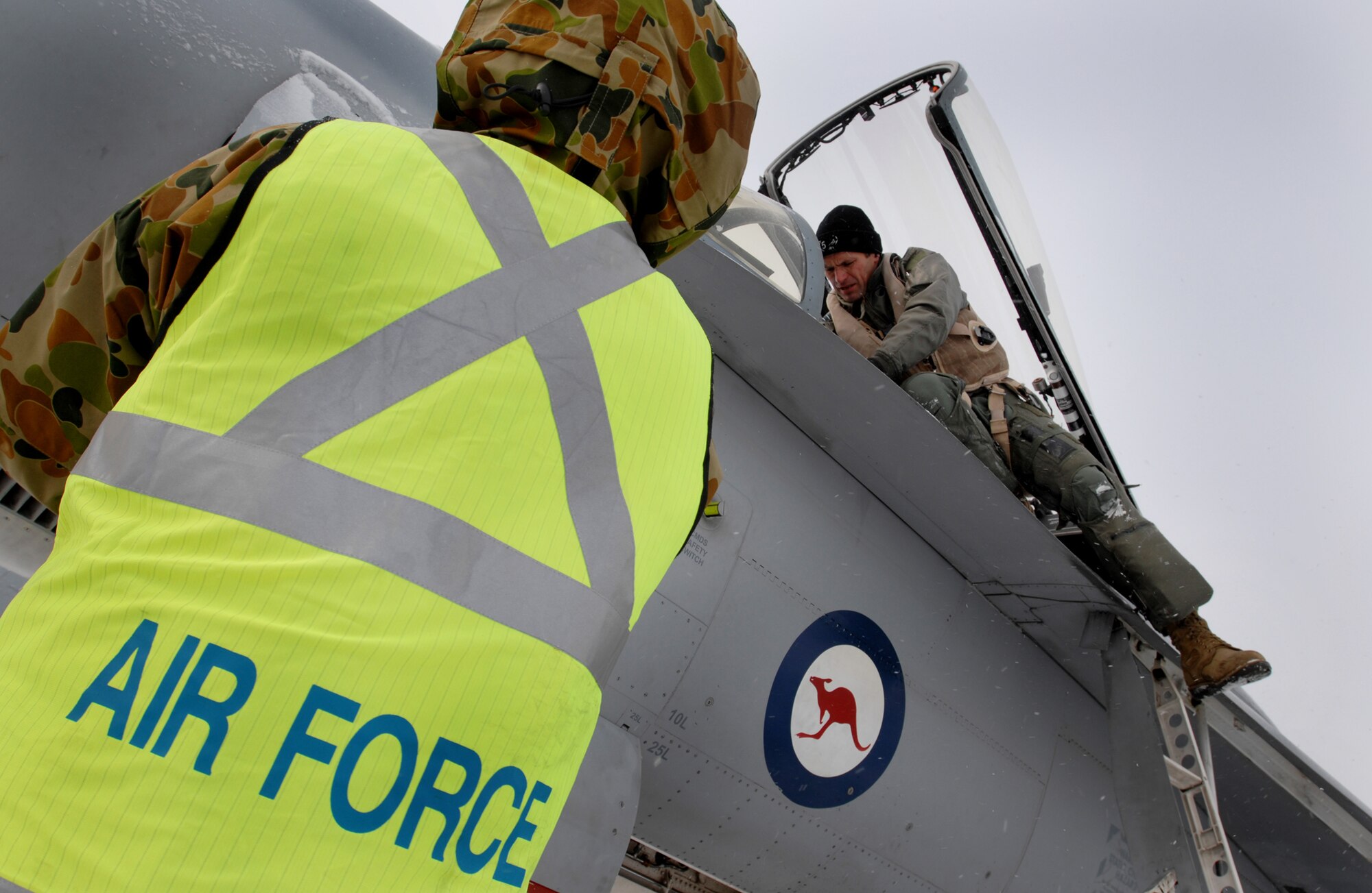 Australian Air Force pilot, Wing Commander Rob Chipman (right) inspects the cockpit controls of a FA-18 Hornet as Australian  Air Force avionics technician Jason Allison (left) inspects a side panel of the fighter jet  prior to the Wing Commander Chipman's training sortie over the Pacific Alaska Range Complex on April 7, 2008 at Eielson Air Force Base, Alaska. The 75th Squadron from the Australian Air Force is participants of the Red Flag-Alaska 08-02 exercise.   Red Flag-Alaska is a series of Pacific Air Forces field training exercises for U.S Forces and allies that provide joint offensive counter-air, indirection, close air support, and large force employment training in a simulated combat environment.

(U.S Air Force Photo by Technical Sgt. Eric T. Sheler)

