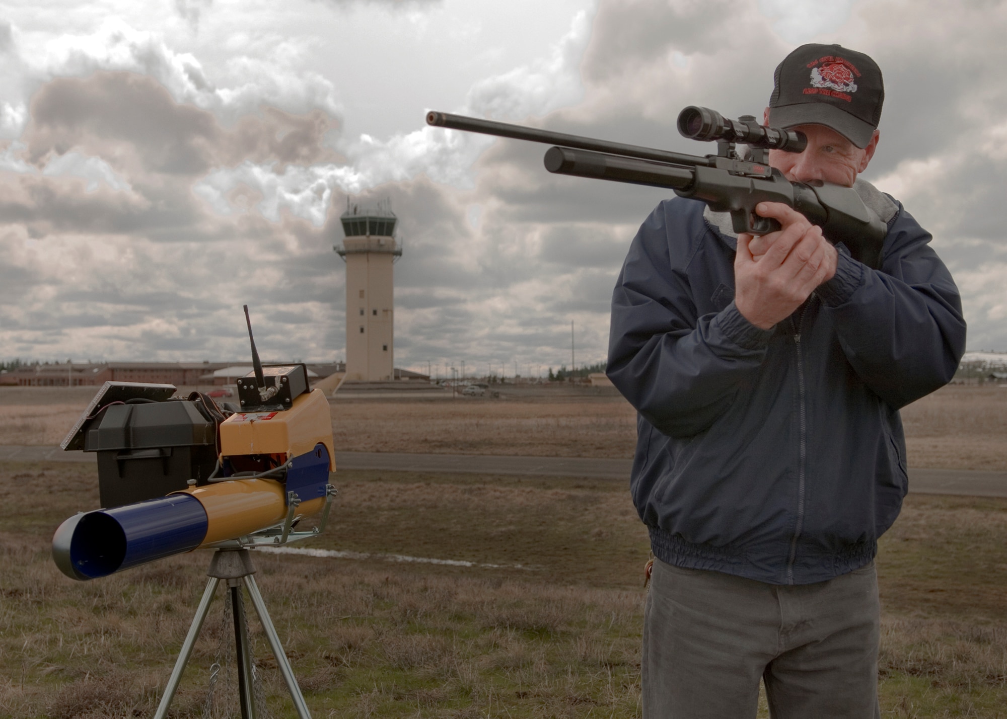 FAIRCHILD AIR FORCE BASE, Wash. – Steven Benson, 92nd Civil Engineer Squadron entomologist and member of the Bird Aircraft Strike Hazard avoidance program, fixes his sight on a bird flying above the airfield here March 1. Mr. Benson selectively depredates the birds when it is determined they pose a risk to the aircraft on or around Fairchild. (U.S. Air Force photo / Airman 1st Class Joshua Chapman)