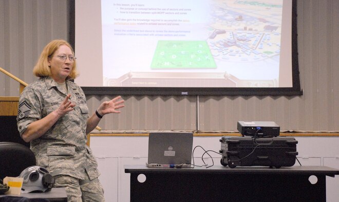 Master Sgt. Phyllis Daniel, emergency manager for the 920th Rescue Wing at Patrick Air Force Base, Fla., teaches a chemical warfare training class during the April Unit Training Assembly.  As a combat search and rescue wing, Rescue Reservists must be war-ready at all times.  Their mission of saving lives extends beyond borders and into the Theater of Operations supporting the war effort and saving the military's most precious cargo, it's servicemembers.