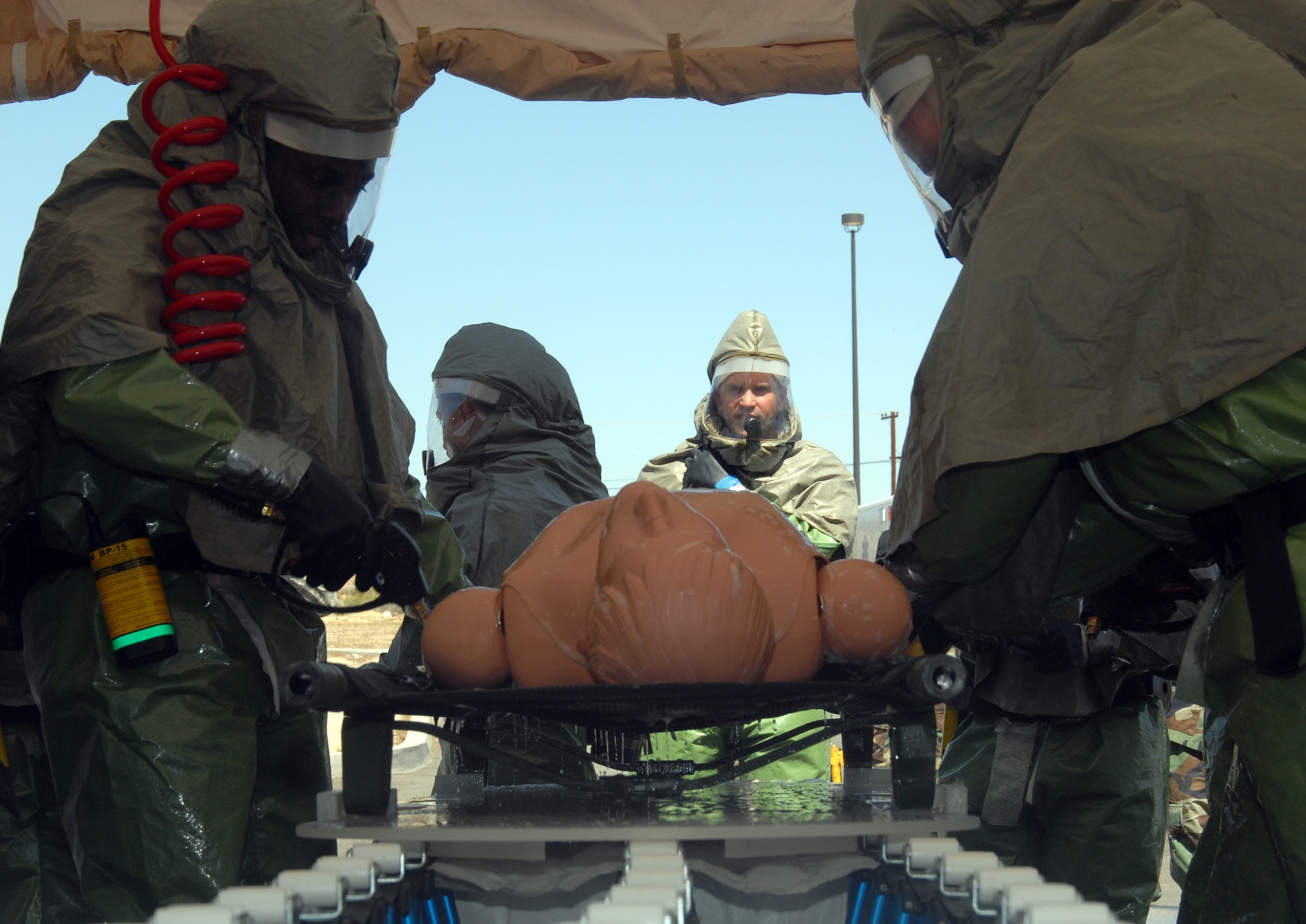 The 95th Medical Group in-place patient decontamination capability team decontaminates a "patient" during an IPPDC training here April 1 and 2. During the training the team registered the second fastest mission capable time of IPPDC equipment set up with a time of four minutes and 12 seconds. The record is four minutes and six seconds. (Air Force photo by Senior Airman Julius Delos Reyes)