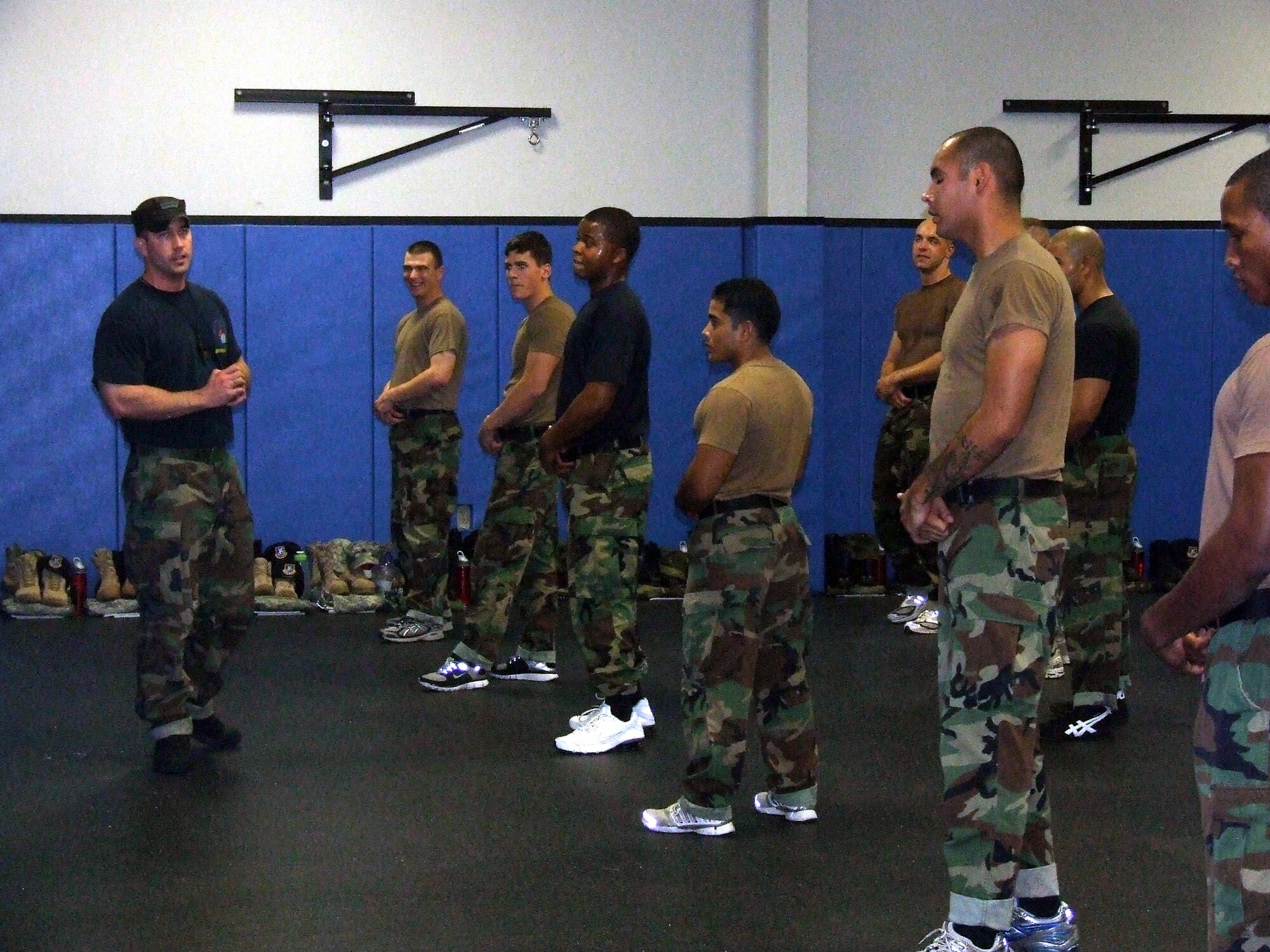 Staff Sgt. Jason Venturella, Phoenix Raven course instructor from the U.S. Air Force Expeditionary Center's 421st Combat Training Squadron, leads Raven students in self defense training April 4, 2008, in the Center on Fort Dix, N.J.  The course, taught by the Center's 421st CTS, teaches Air Force security forces, Army military police and Navy security forces in areas of self defense, aircraft security, verbal judo and many related courses.  (U.S. Air Force Photo/Tech. Sgt. Scott T. Sturkol)