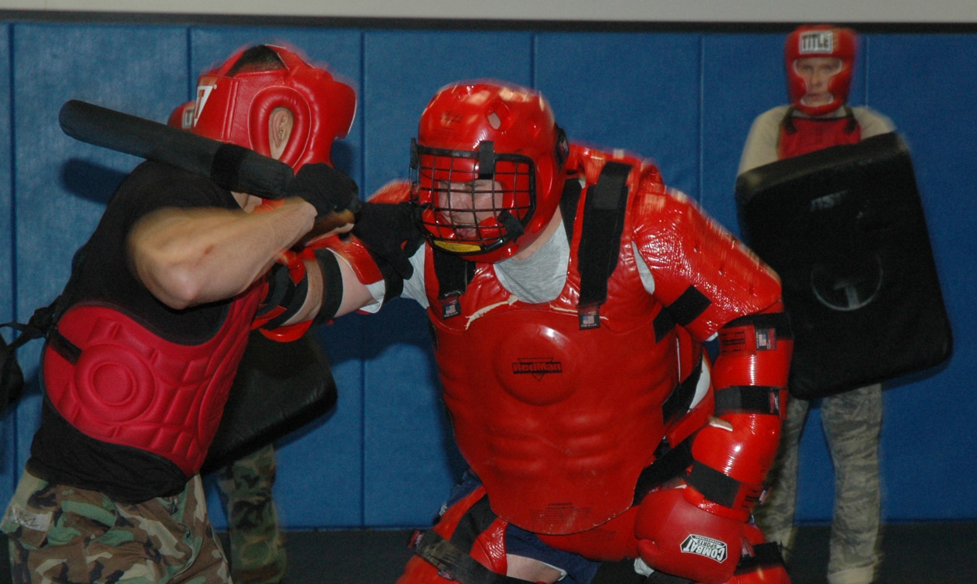 Students in the Air Force Phoenix Raven Course practice self defense moves using a baton against an "aggressor" in a red-man suit during training April 4, 2008, in the U.S. Air Force Expeditionary Center on Fort Dix, N.J.  The course, taught by the Center's 421st Combat Training Squadron, teaches Air Force security forces, Army military police and Navy security forces in areas of self defense, aircraft security, verbal judo and many related courses.  (U.S. Air Force Photo/Tech. Sgt. Scott T. Sturkol)