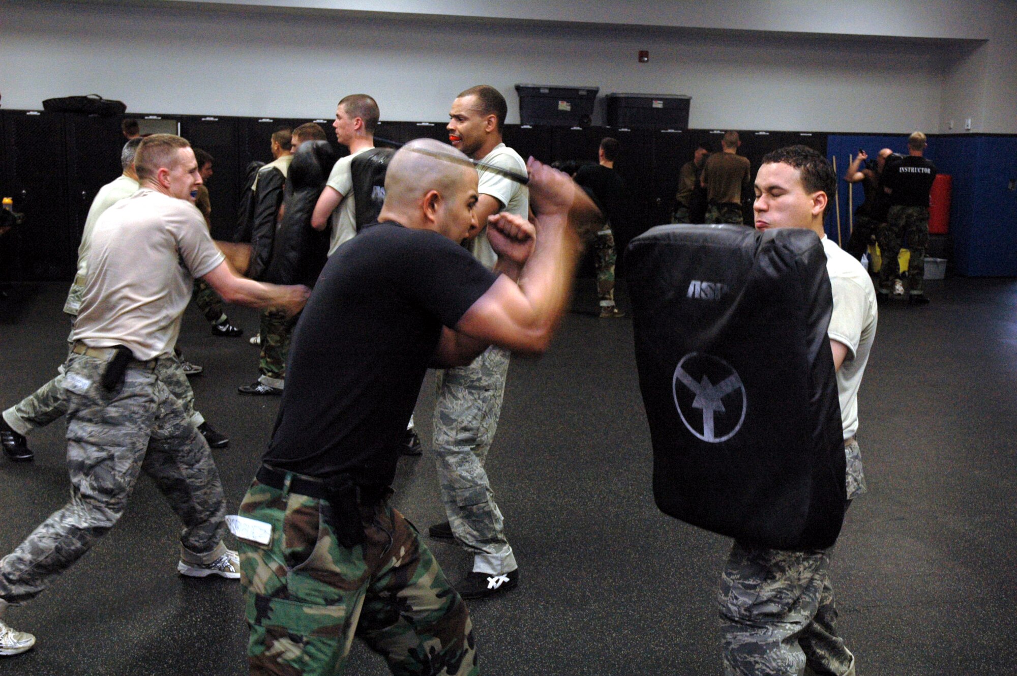 Students in the Air Force Phoenix Raven Course practice self defense moves using a baton during training in the course April 4, 2008, in the U.S. Air Force Expeditionary Center on Fort Dix, N.J.  The course, taught by the Center's 421st Combat Training Squadron, teaches Air Force security forces, Army military police and Navy security forces in areas of self defense, aircraft security, verbal judo and many related courses.  (U.S. Air Force Photo/Tech. Sgt. Scott T. Sturkol)