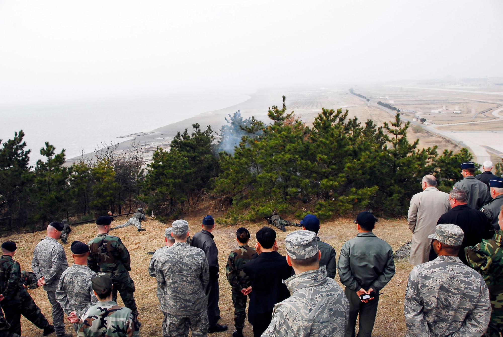Airmen from the 8th Security Forces Squadron demonstrate base defense tactics April 2 for Air Force Board members visiting Kunsan Air Base, South Korea. They were there to get a first hand look at the base and its mission. (U.S. Air Force photo/Tech. Sgt. Quinton T. Burris) 