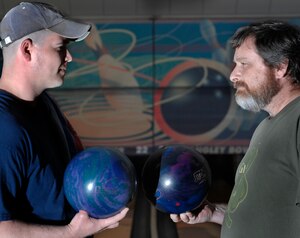 LANGLEY AIR FORCE BASE, Va. -- Ray Merrow of the 1st Communications Squadron and Jeff Yager from Air Combat Command Intelligence Directorate pair off during the intramural bowling league championship tournament April 3 at Langley’s Bowling Center. (U.S. Air Force photo/Senior Airman Christopher L. Ingersoll)
