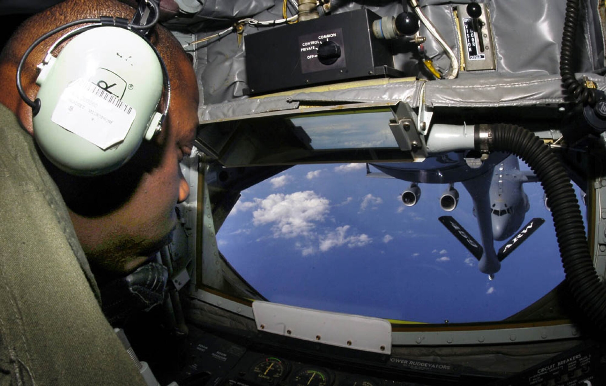 ANDREWS AIR FORCE BASE, Md. -- Tech. Sgt. Willie Cooper, 756th Air Refueling Squadron boom operator, works the control guiding the refueling nozzle on a KC-135 Stratotanker aircraft during a refueling mission over Atlantic City, N.J., March 15. (U.S. Air Force photo/Bobby Jones)