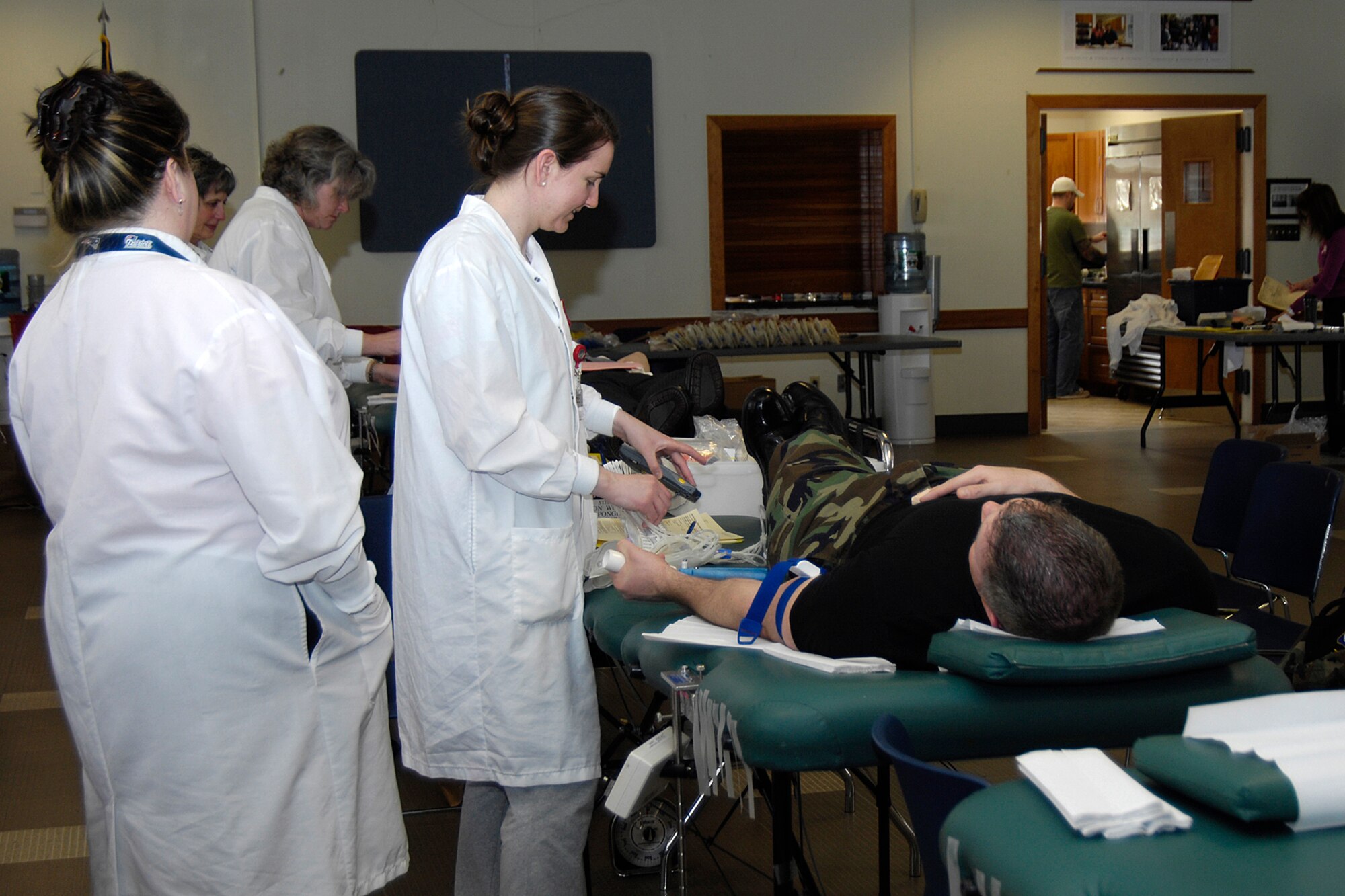 HANSCOM AFB, Mass. – A Hanscom servicemember donates blood during a Red Cross Blood Drive at the Base Chapel April 7. This was the second blood drive at Hanscom this year. For more information on donating blood through the Red Cross, visit www.redcross.org/donate/give. (U.S. Air Force photo by Linda LaBonte Britt)