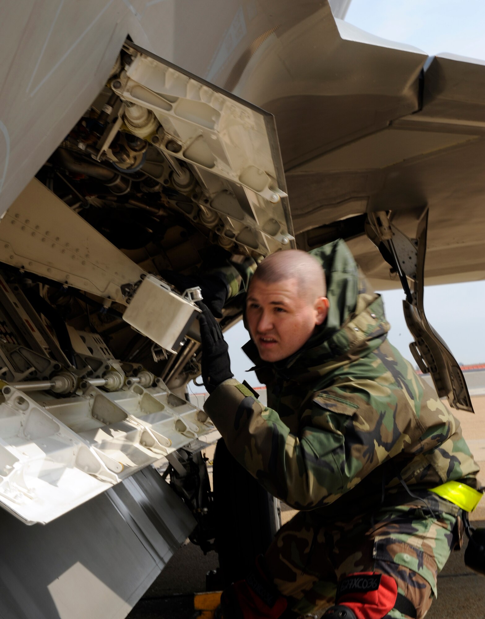 LANGLEY AIR FORCE BASE, Va. -- Staff Sgt. James Wallace of the 1st Aircraft Maintenance Squadron checks the missile rails during a weapons loading competition April 4. The weapons loading competition, commonly referred to as “loadio,” is conducted to sharpen the skills of weapons loaders to ensure that their job is done quickly and without mistakes.  (U.S. Air Force photo/Senior Airman Christopher L. Ingersoll)