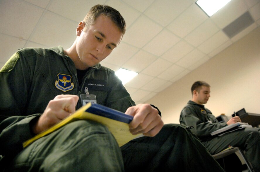 Second Lt. Andrew Barrier takes a test April 7 during the Doss Aviation Initial Flight Screening Course in Pueblo, Colo. The course mission is to screen aviation candidates and develop student's aviation skills. From day one the students are tested physically and mentally in a high-intensity environment. (U.S. Air Force photo/Tech. Sgt. Cecilio Ricardo) 