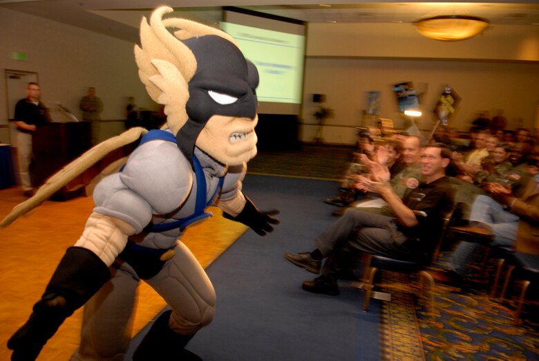 VANDENBERG AIR FORCE BASE, Calif. -- Vandenberg's mascot, Hawkman, cheers on the crowd after he is announced at the Guardian Challenge kickoff event on April 4. The event was held to present the team to the 30th Space Wing and to provide the team with competition uniforms. Guardian Challenge in the only space and missile competition in the Air Force. (U.S. Air Force photo/Airman 1st Class Christian Thomas) 
