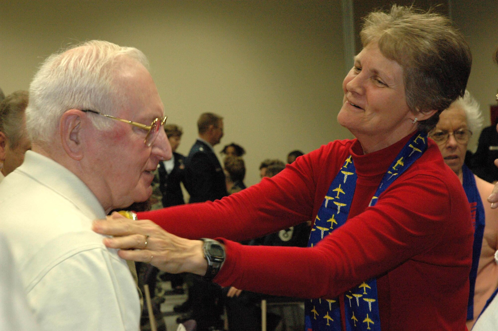 MCGUIRE AIR FORCE BASE, N.J. -- Former first sergeant of the 714th Aeromedical Evacuation Squadron, Chief Master Sgt. (Ret.) Frederick LaPlume and Lt. Col. (Ret.) Linda Pugsley reminiscence about their time together while serving as members of the Air Force Reserve unit during the deactivation ceremony March 29. Chief Pugsley was the first air reserve technician nurse in the 714th AES and designed the squadron patch in 1974. (U.S. Air Force photo/Master Sgt. Chuck Kramer)