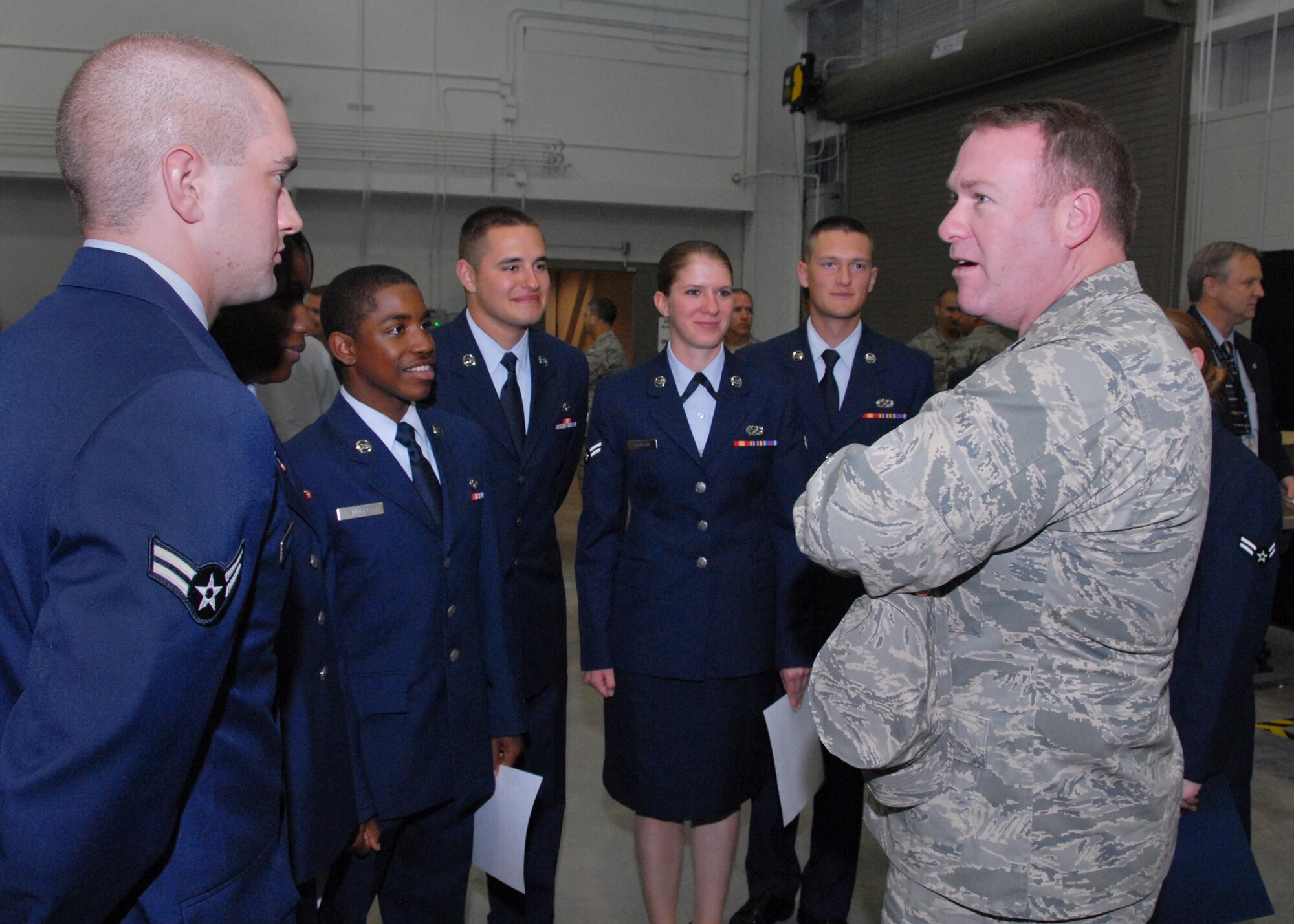Lt. Col. Thomas Ventriglia, 363rd Training Squadron commander, talks to F-22 Raptor Armament Systems graduates April 7 at thse course's graduation ceremony. The eight Airmen who graduated from the course were the first Raptor maintenance Airmen to graduate from the brand-new, $21 million Raptor Maintenance Training Facility. (U.S. Air Force photo/Mike  litteken)