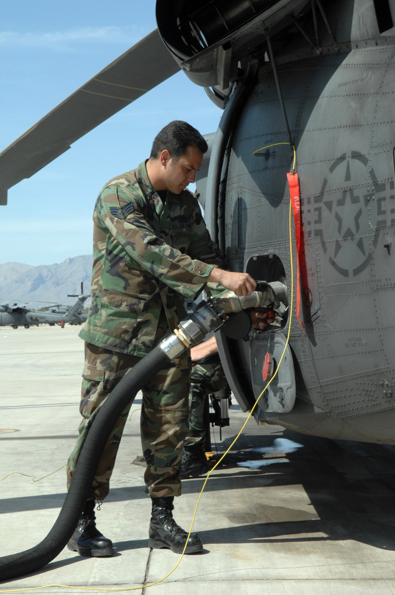 Senior Amn. Michael Craig, 563rd Maintenance Squadron, 55th Helicopter Maintenance Unit, fuels an HH-60 helicopter at Davis-Monthan AFB, Arizona, on April 4, 2008. (U.S. Air Force photo/Airman 1st Class Noah R. Johnson)