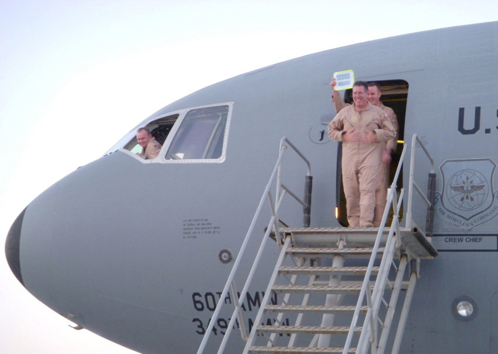 Senior MSgt Robert Fisher, 908th Expeditionary Air Refueling Squadron Flight Engineer, steps off a KC-10 Extender after his landmark flight, surpassing 10,000 flight hours March 29, 2008.  (U.S. Air Force photo)