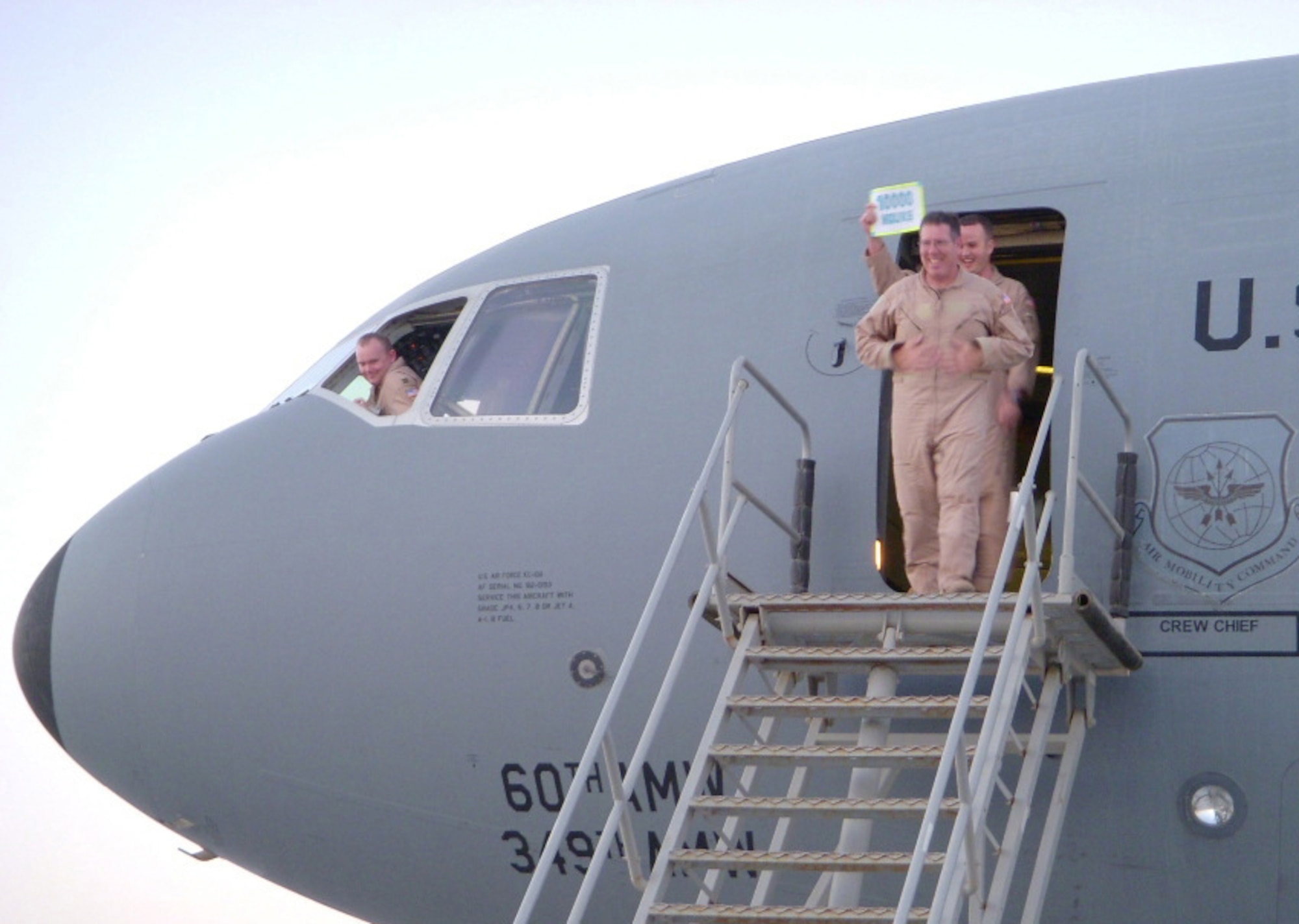 Senior MSgt Robert Fisher, 908th Expeditionary Air Refueling Squadron Flight Engineer, steps off a KC-10 Extender after his landmark flight, surpassing 10,000 flight hours March 29, 2008.  (U.S. Air Force photo)