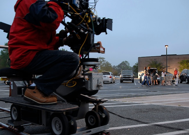 A cameraman for the Lifetime television show "Army Wives" films a scene for an upcoming episode April 7 on Charleston Air Force Base, S.C. A few episode scenes were filmed at the Charleston AFB base exchange for a more authentic look. (U.S. Air Force photo/Airman 1st Class Katie Gieratz) 