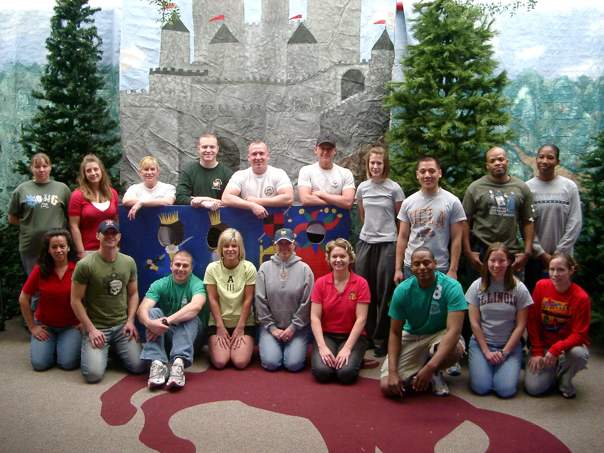 CANNON AIR FORCE BASE, N.M. -- Volunteers stand in front of the entrance to Mesa Elementary School's Renaissance Fair April 5.  More than 20 volunteers,14 of whom were from Cannon's Company Grade Officers Council, decorated the school for the month-long fair.(Air Force photo/Capt. Mae-Li Allison)

