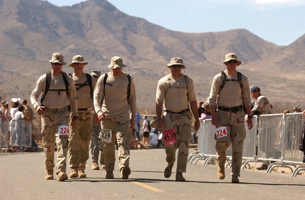 WHITE SANDS MISSILE RANGE, N.M. --  (From left) Capt. Ethan Mattox, Capt. Chad Briggs, Capt. Christopher Fernengel, 1st Lt. Anthony Alvarado and Capt. Jon Slaughter get a rare walk on asphalt during the Bataan Memorial Death March on March 30. The 19th annual memorial march was in honor of the servicemembers who were forced to march almost 70 miles with little food and water after surrendering to the Japanese in the Phillippines during World War II. (Courtesy photo) 