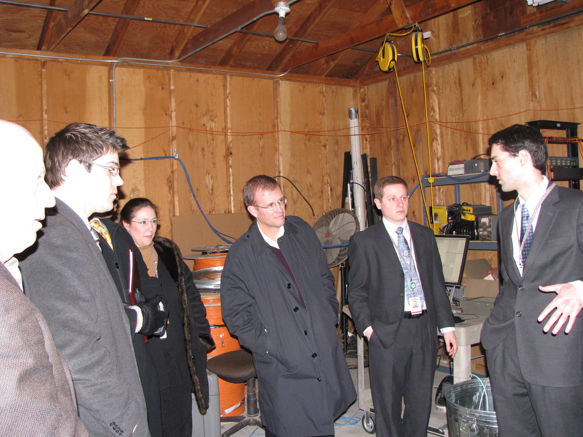 Some members of the BAE and DARPA MUD Radio Development Team discussing results of the first demonstration of the technology. Left to right are Joshua Niedzwiecki (BAE Systems), Dr. Rachel Learned (BAE Systems), Dr. Brian Pierce (DARPA), John Tranquilli (BAE Systems), Joseph Farkas  (BAE Systems).