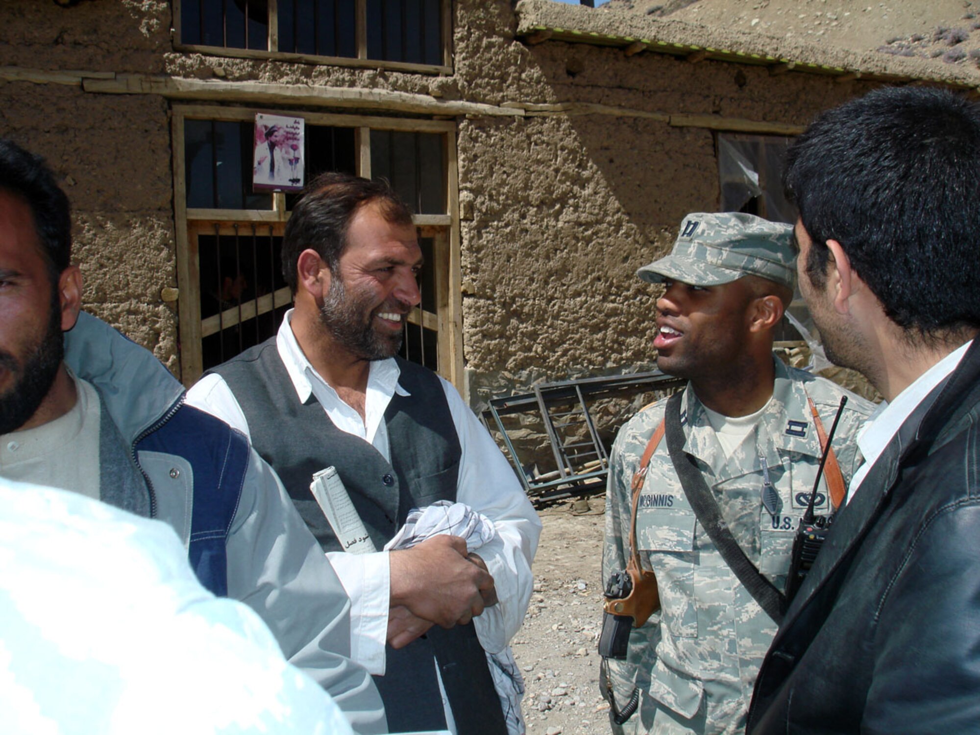 PANJSHIR, Afghanistan -- Capt. Kenneth McGinnis discusses specifications of a foundation for a schoolbook repository with Haji Fada the project’s main contractor at the Khenj District Center April 1. The $220,000 building is expected to be complete in January 2009 and furthers one of the key tenets of the PRT mission -- governance.  (U.S. Air Force photo by Capt. Jillian Torango)