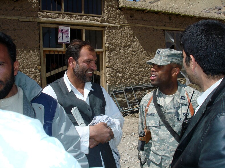 PANJSHIR, Afghanistan -- Capt. Kenneth McGinnis discusses specifications of a foundation for a schoolbook repository with Haji Fada the project’s main contractor at the Khenj District Center April 1. The $220,000 building is expected to be complete in January 2009 and furthers one of the key tenets of the PRT mission -- governance. (U.S. Air Force photo/ Capt. Jillian Torango) 

