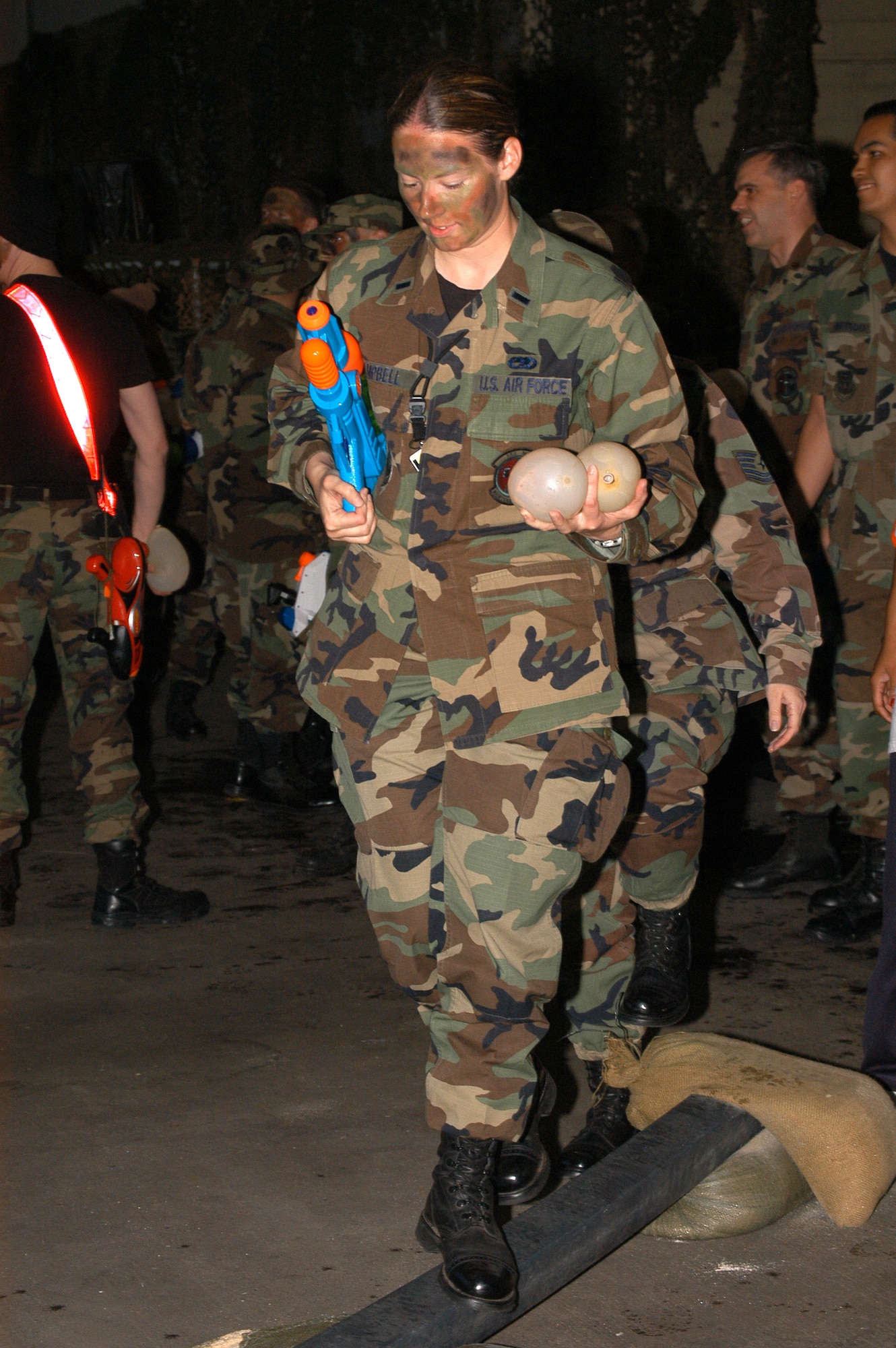 1st Lt.  Michelle Campbell, 353rd Maintenance Squadron, makes her way across the plank portion of the obstacle course during the 353rd Special Operations Group's Combat Dining Out.                                