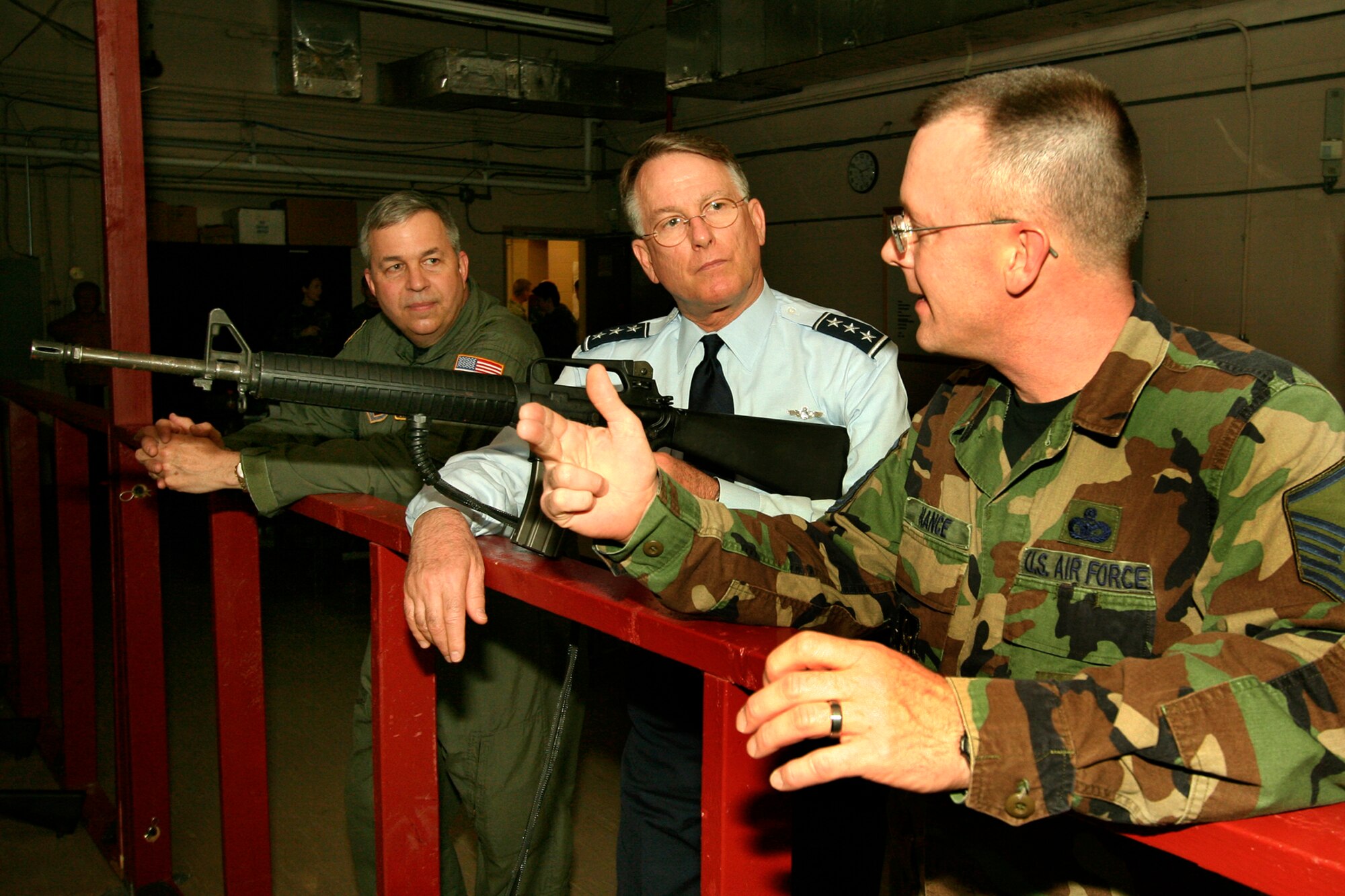 GRISSOM AIR RESERVE BASE, Ind., -- Lt. Gen. John Bradley, center, commander of the Air Force Reserve Command, and Brig. Gen. Dean Despinoy, far left, 434th Air Refueling Wing commander, receive a briefing on the firearms training simulator from Master Sgt. Chet Nance, NCOIC of combat arms. General Bradley toured Grissom during the April unit training assembly and was the featured guest speaker at the military ball. (U.S. Air Force photo/Tech. Sgt. Patrick Kuminecz)