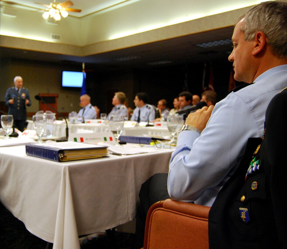 Italian Brig. Gen. Franco Marsigliam, right, listens as the Royal Netherlands Air Force's Air Commodore Berlijn makes final comments April 4 to steering committee members of the Euro-NATO Joint Jet Pilot Training Program at Sheppard Air Force Base, Texas. The general is the new chairman of the committee, replacing Air Commodore Berlijn. (U.S. Air Force photo/John Ingle)