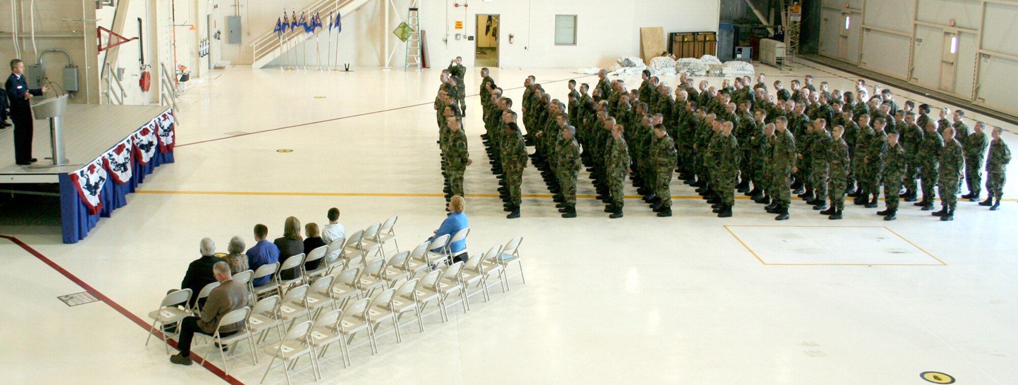 GRISSOM AIR RESERVE BASE, Ind., -- Members of the 434th Aircraft Maintenance Squadron stand in formation as they listen to their new commander, Capt. Timothy Bartlett. Captain Bartlett took command of the 434th AMXS from Lt. Col. Stephen Whicker, during the April unit training assembly. (U.S. Air Force photo/Tech. Sgt. Patrick Kuminecz)