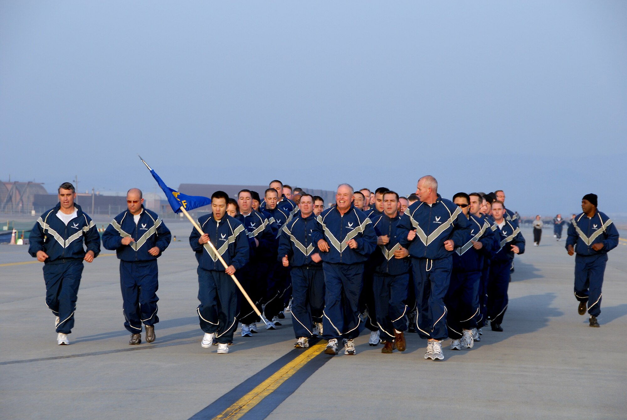 OSAN AIR BASE, Republic of Korea--Lt. Gen. Stephen G. Wood, commander 7th Air Force, (center), runs with members of Team Osan around the Osan flightline during the Air Power run on April 4.  (U.S. Air Force photo/Staff Sgt Lakisha Croley)