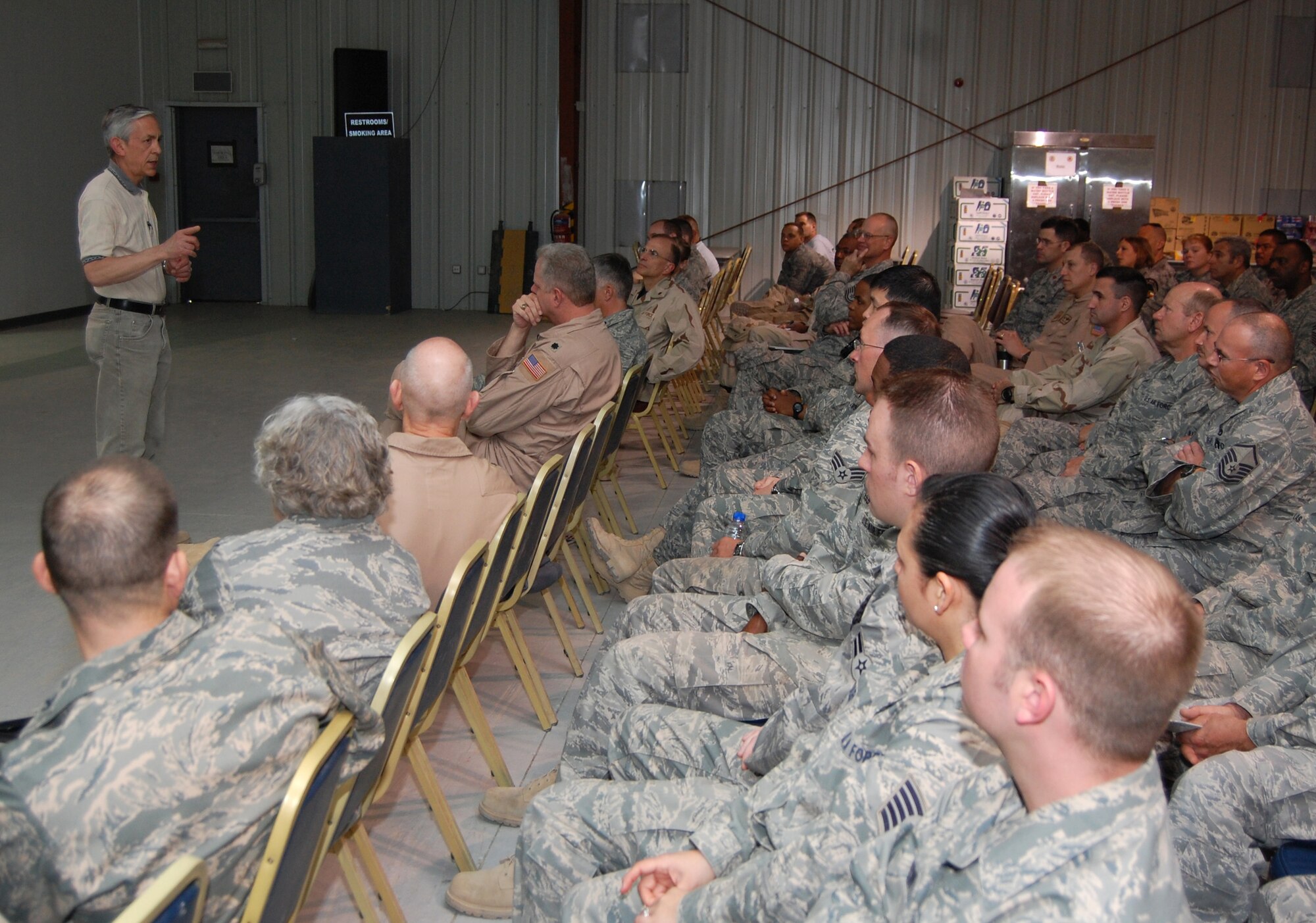 SOUTHWEST ASIA -- The Honorable Craig Duehring, the Assistant Secretary of the Air Force for Manpower and Reserve Affairs, Washington, D.C., talks with Airmen from the 386th Air Expeditionary Wing at an air base in the Persian Gulf Region recently. The visit is the first of many for Mr. Duehring, Brig. Gen. William Busby, and Col. Anne Hamilton, as they make their way through the deployed theater to gain insight on manpower, morale, and Reserve affairs issues affecting today’s Airmen and much more. (Air Force photo/Tech. Sgt. Michael O'Connor)
