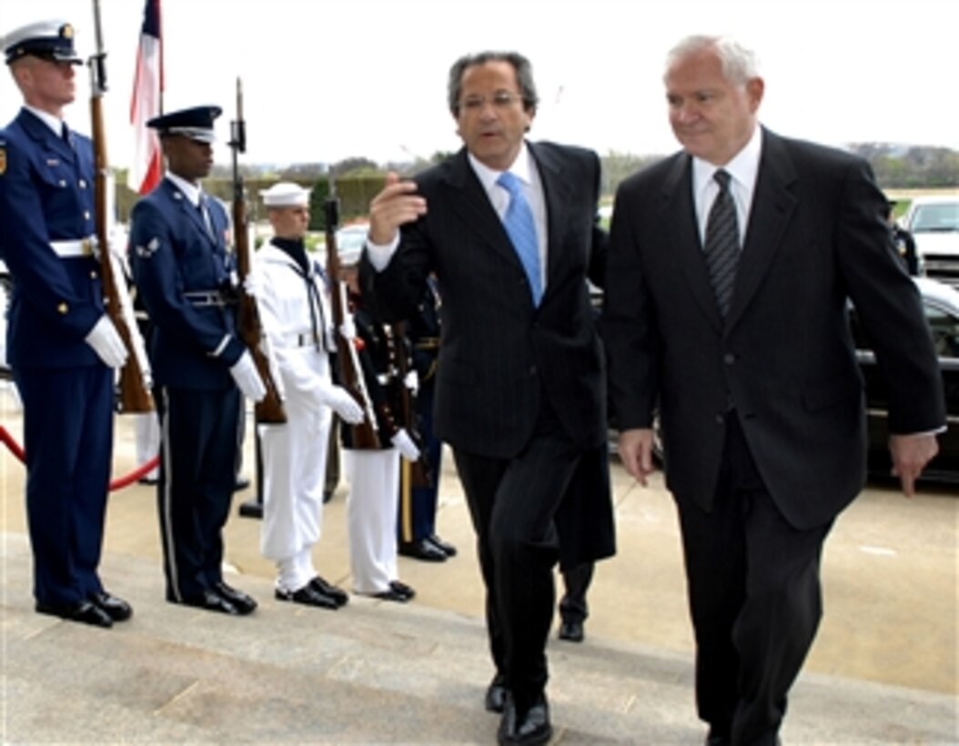 U.S. Defense Secretary Robert M. Gates, right, escorts Chilean Defense Minister Jose Goni through an honor cordon into the Pentagon, April 8, 2008, before meeting to discuss bilateral security issues.