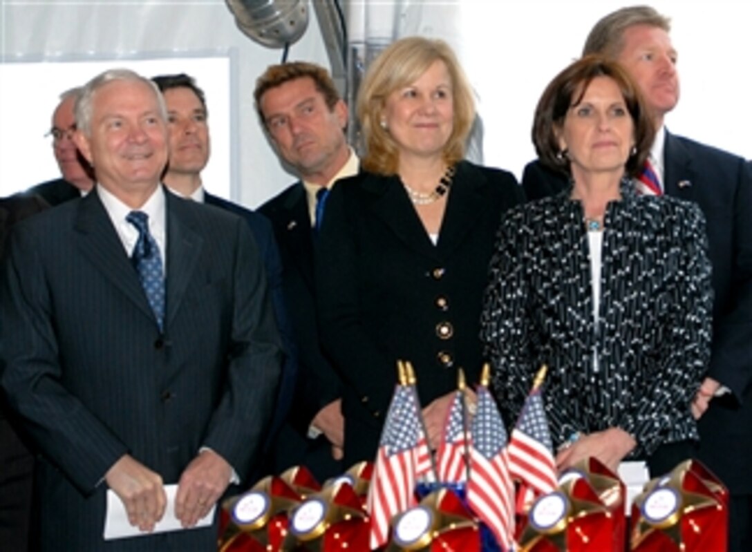 Defense Secretary Robert M. Gates, stands with Our Military Kids co-founders Gail Kruzel, center, and Linda Davidson, right, before speaking at a reception April 7, 2008, to honor military children. The organization has reached the $1 million mark in grants awarded to military kids for extracurricular activities. 