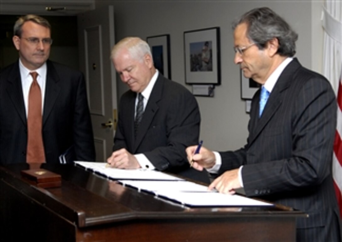 Defense Secretary Robert M. Gates and Chilean Defense Minister Jose Goni sign a Master of Information Exchange Agreement during a short ceremony inside the Pentagon, April 8, 2008.  