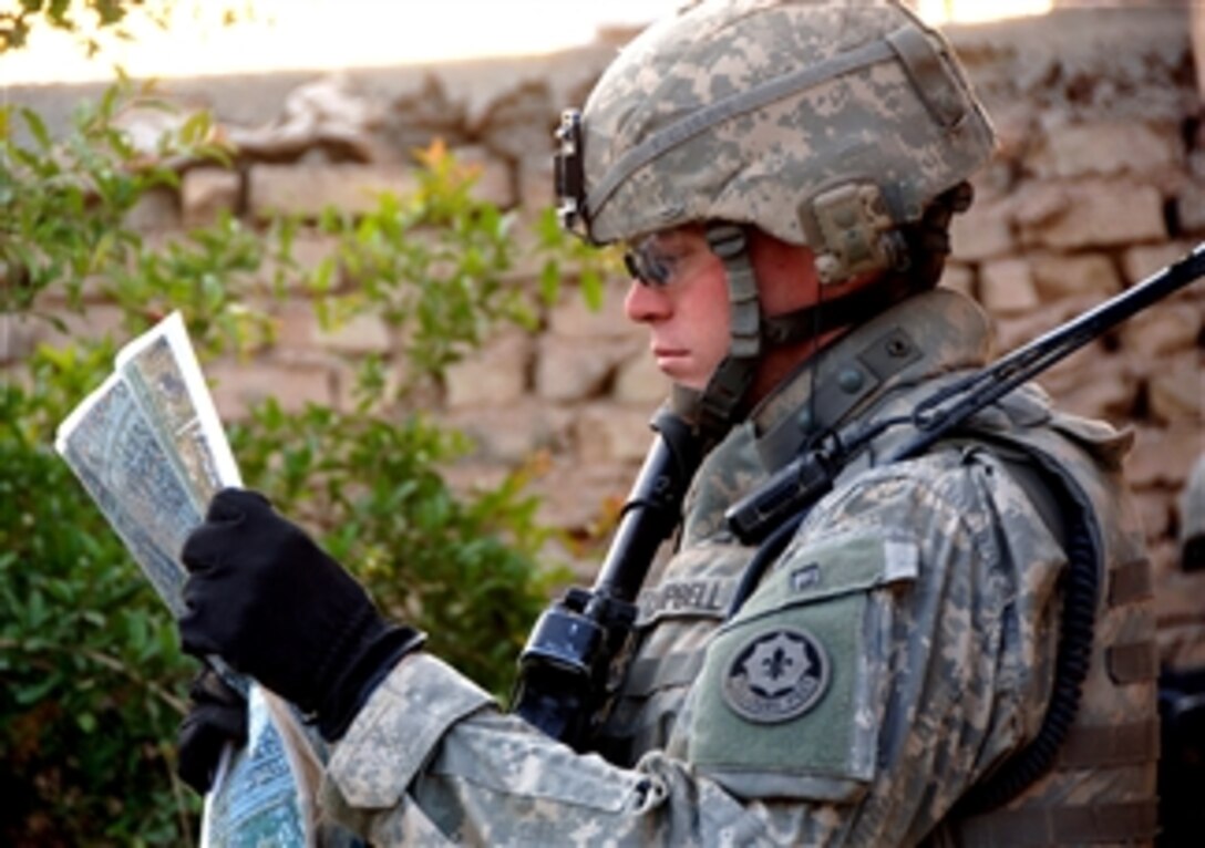 U.S. Army 1st Lt. Casey Cambell looks over a map in Muqdadiyah, Iraq, April 6, 2008. Campbell is with 3rd Squadron, 2nd Calvary Striker Regiment. 