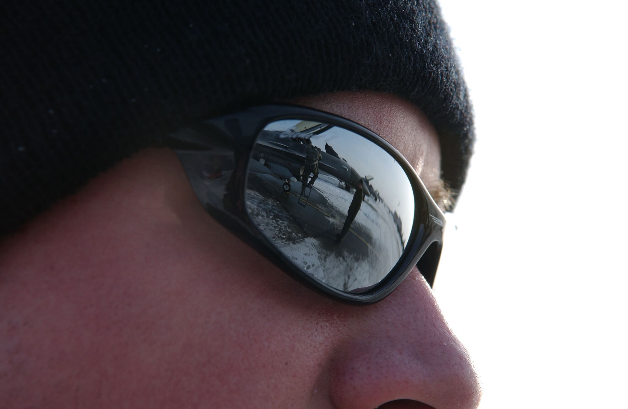 Airman 1st Class Danny Reynolds watches Capt. Bryan Spence climb into an F-16 Fighting Falcon during pre-flight inspection process which ensures maximum aerodynamic performance of the aircraft while in flight April 8 at Eielson Air Force Base, Alaska. RED FLAG-Alaska 08-2 is a Pacific Air Forces command directed field training exercise which provides joint offensive counter-air, interdiction, close air support, and large force employment training in a simulated combat environment. Both are assigned to Misawa Air Base, Japan. (U.S. Air Force Photo/Airman 1st Class Jonathan Snyder) (Released)