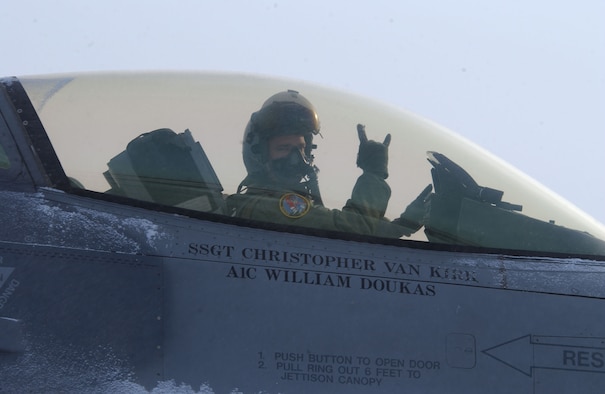 Capt. Bryan Spence signals from an F-16 Fighting Falcon while moving down the taxi way April 8 at Eielson Air Force Base, Alaska. RED FLAG-Alaska 08-2 is a Pacific Air Forces command directed field training exercise which provides joint offensive counter-air, interdiction, close air support, and large force employment training in a simulated combat environment. He is assigned to Misawa Air Base, Japan. (U.S. Air Force Photo/Airman 1st Class Jonathan Snyder) (Released)