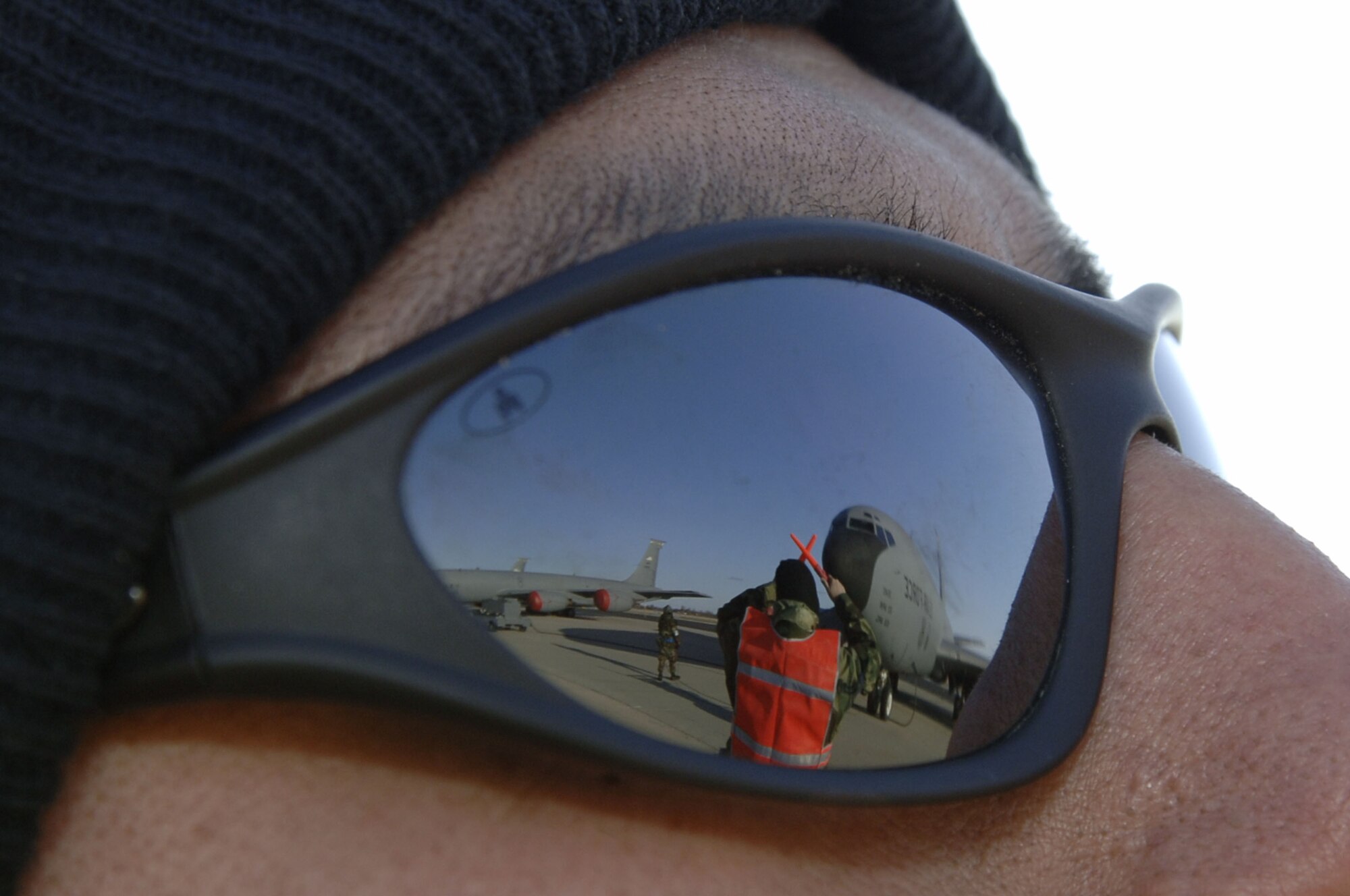 VOLK FIELD AIR NATIONAL GUARD BASE, Wis. -- Tech. Sgt. Ishmael Hernandez, a maintainer from McConnell Air Force Base, Kan., watches as Tech. Sgt. Joe Healy, a maintainer from McConnell marshals a KC-135 Stratotanker on Apr. 1 at an exercise in Volk Field.  Units from the 22nd Air Refueling Wing, 134th Air Refueling Wing, 931st Air Refueling Group and 156th Aerial Port Flight are exercising together at Volk Field to make up the 804th Air Expeditionary Wing. (Photo by Tech. Sgt. Chyrece Campbell)