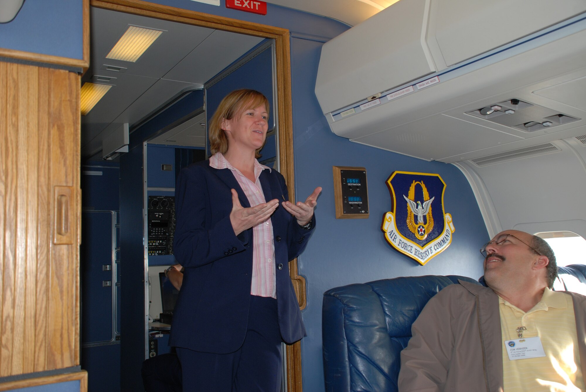 Tech Sgt. April Tarbill, a flight attendant on the 932nd Airlift Wing's C-9C, talks to civic leaders on the final journey back to Scott Air Force Base from Chicago.  Local leaders included mayors, business owners and civic leaders from a variety of backgrounds enjoyed a visit the Air Force Museum in Ohio and a stop at Patrick AFB in Florida to see the 920th Air Force Reserve rescue wing there.  Photo/Tech Sgt. Gerald Sonnenberg