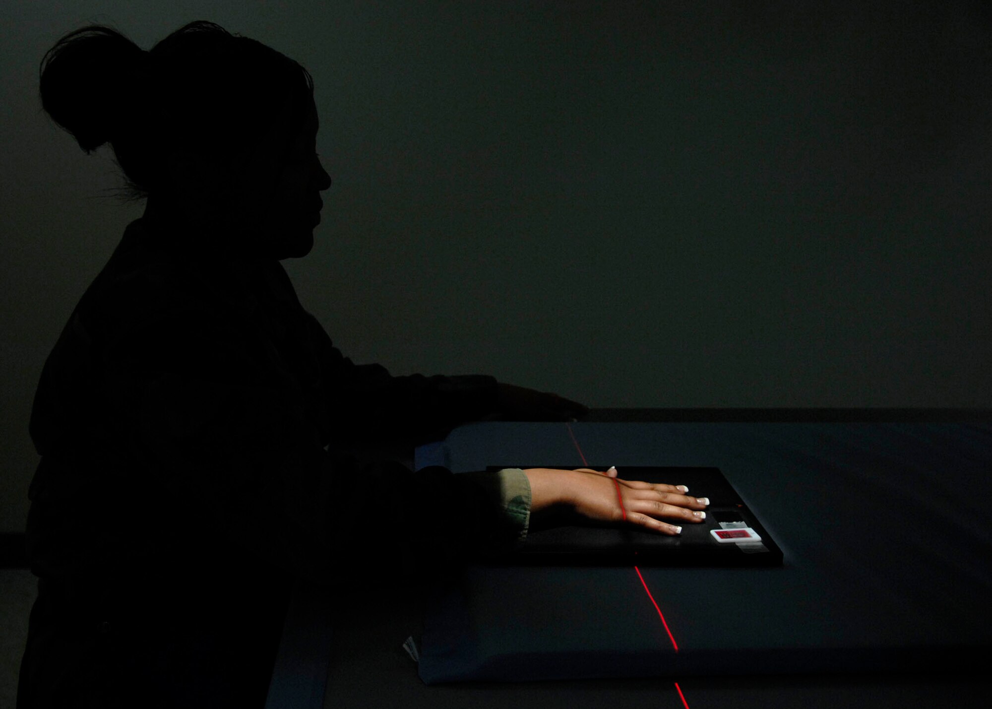 HOLLOMAN AIR FORCE BASE, N.M. -- Airman 1st Class Jennifer Davis, 49th Medical Support Squadron, gets an X- ray of her hand. X-rays are useful in the detection of pathology of the skeletal system but are also used to detect some disease processes. (U.S. Air Force photo by Airman 1st Class Rachel A. Kocin)