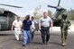 SOTO CANO AIR BASE, Honduras-- Army flight medic Staff Sgt. Joseph McCormick leads Honduran medical professionals away from a Blackhawk helicopter during an information exchange at Hospital Militar Luis Alonso Discua. One aspect of the exchange was familiarization with practicing safe delivery and recovery of patients to a running JTF-Bravo MEDEVAC helicopter. 
