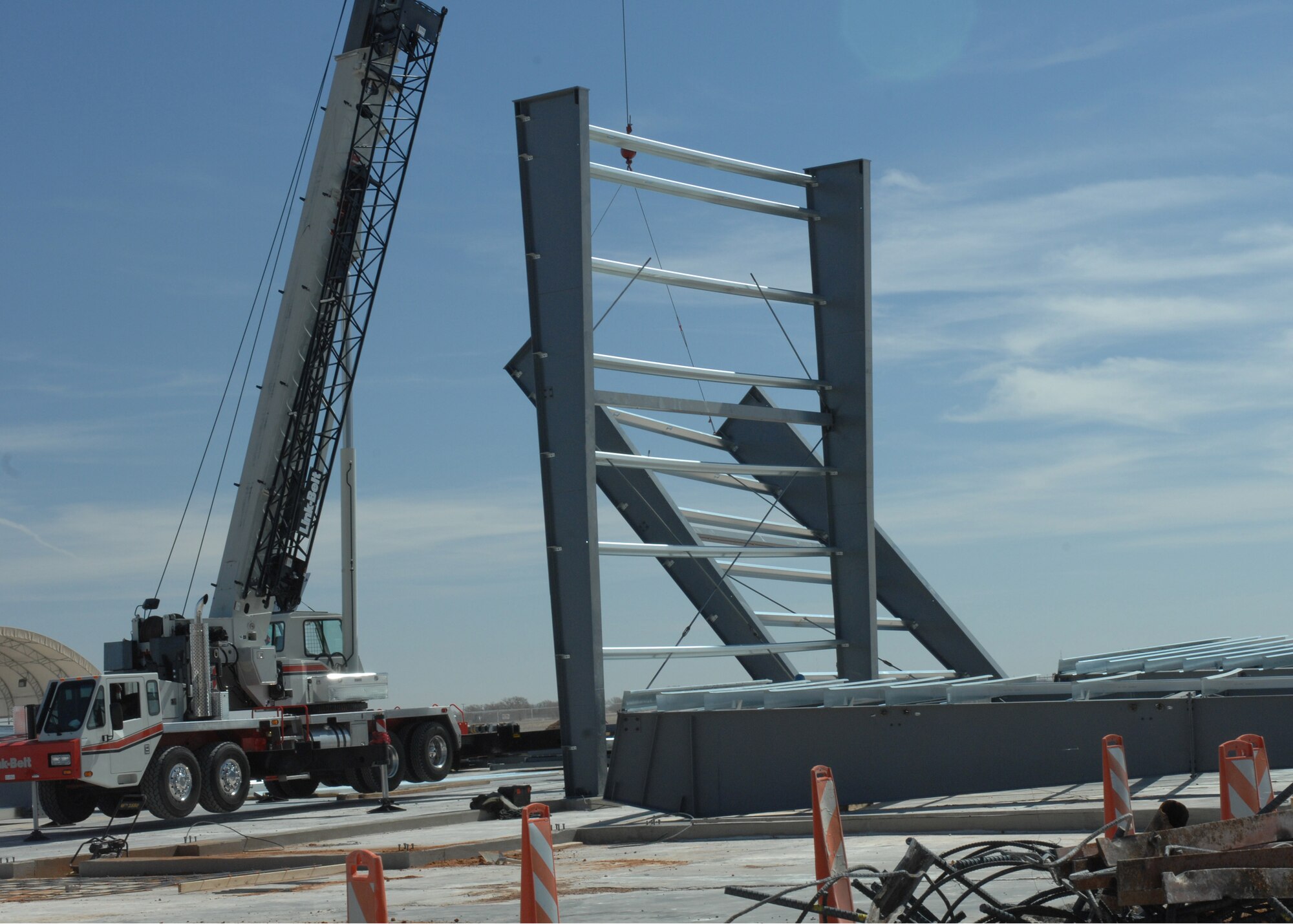 CANNON AIR FORCE BASE N.M.--Butler Construction company pulls a support beam into place on the flight line.  The first hanger should ready sometime in July.  (U.S. Air Force photo by A1C James R. Bell)