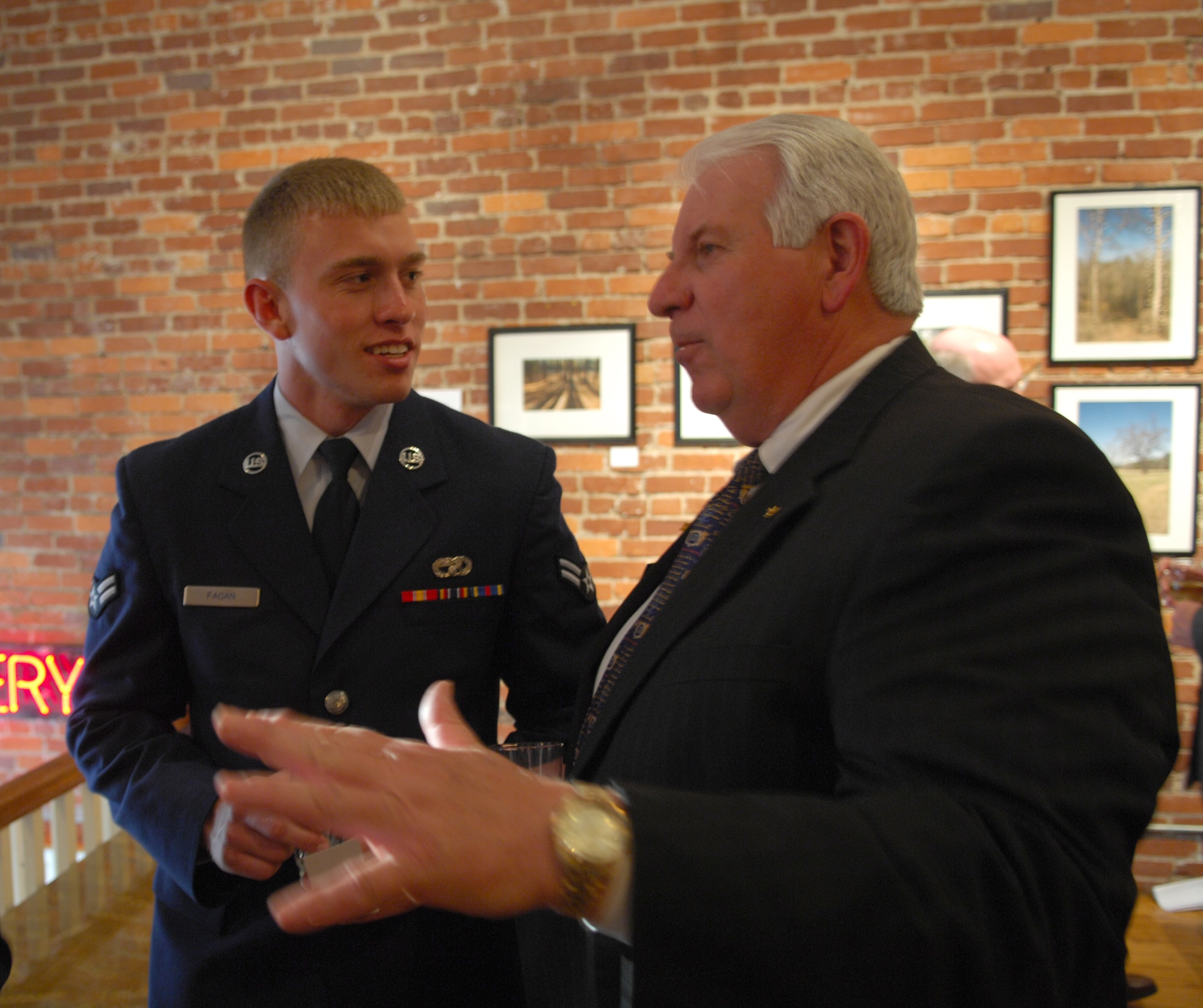 SHAW AIR FORCE BASE, S.C.--  Airman First Class Blake Fagan, 20th Logistics Readiness Squadron, speaks with Carl McIntosh, Assistant Dean for University of South Carolina Advancement, during Sumter County Legislative Day at the City Art Gallery, Columbia, SC, April, 2 2008.  Sumter Legislative Day provides the opportunity to display outstanding qualities and attributes of Sumter County.  Shaw AFB is the largest employer in Sumter County. (U.S. Air Force photo/SrA William Coleman)