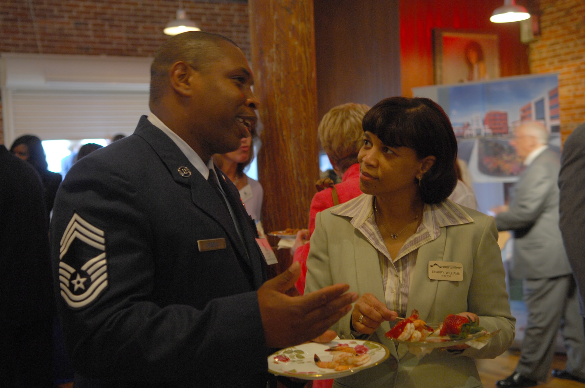 SHAW AIR FORCE BASE, S.C.--  Chief Master Sergeant Arnell Credle, 20th Fighter Wing Acting Command Chief Master Sergeant, speaks with Sharry Williams, Executive Realtor, during Sumter County Legislative Day at the City Art Gallery, Columbia, SC, April, 2 2008.  Sumter Legislative Day provides the opportunity to display outstanding qualities and attributes of Sumter County.  Shaw AFB is the largest employer in Sumter County. (U.S. Air Force photo/SrA William Coleman)