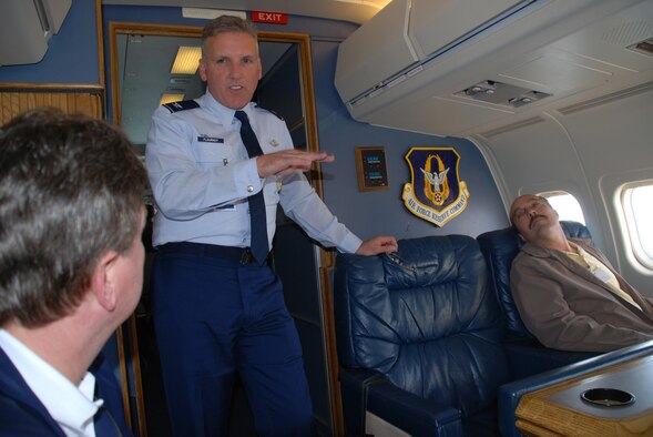 Col. Jay Flournoy, commander of the Air Force Reserve Command's distinguished visitor flying mission in Illinois, explains the role of the C-9C plane.  He and the aircrew provided information about the 932nd Airlift Wing during a recent flight.  Photo/Tech Sgt. Gerald Sonnenberg