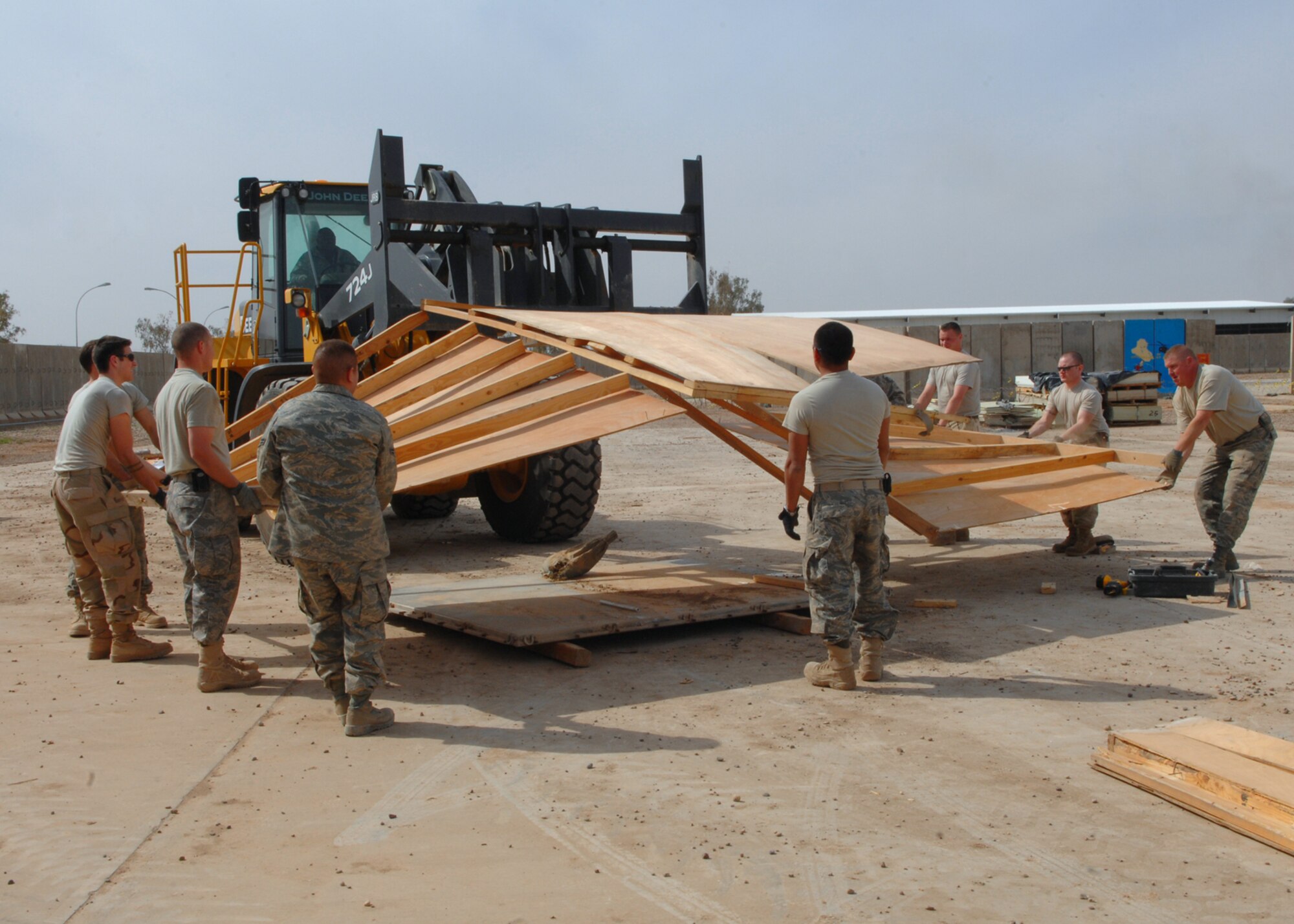 BALAD AIR BASE, Iraq -- Members of the 332nd Expeditionary Civil Engineer Squadron pull apart the entry way of the old Air Force Theater Hospital emergency room tent that will be shipped to the National Museum of Health and Medicine in Washington, D.C., here, Feb. 29. The tent is slated for exhibition because it is known, by the medical community, as the place where the most American blood was spilled since the Vietnam War. (U.S. Air Force photo/ Senior Airman Julianne Showalter)