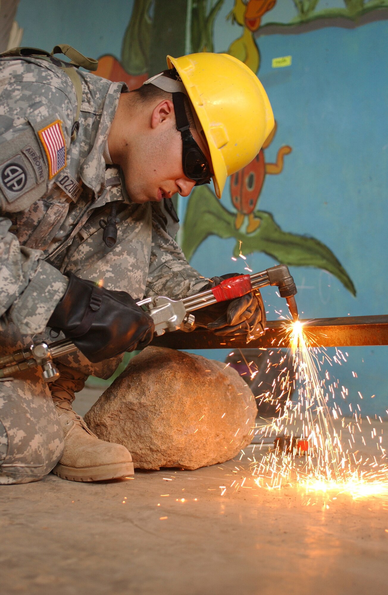 LAS MESAS, Honduras: U.S. Army Reserve welder Sgt Juan M. Ozuna of the 672nd Engineer Company constructs burglar bars for the grade school of this rural village. Soldiers from the 672nd, 756th, and 1430th Engineer Companies are working in Las Mesas during the joint forces training exercise Beyond the Horizon. They will replace the school's doors and windows, repair the roof, and repaint the entire structure, in addition to improving a soccer field on which local children play. Beyond the Horizon provides infrastructure renovation, as well as basic medical and dental care, to areas across this Central American country. (Photo by Sgt. Claude W. Flowers, 304th Public Affairs Detachment.)