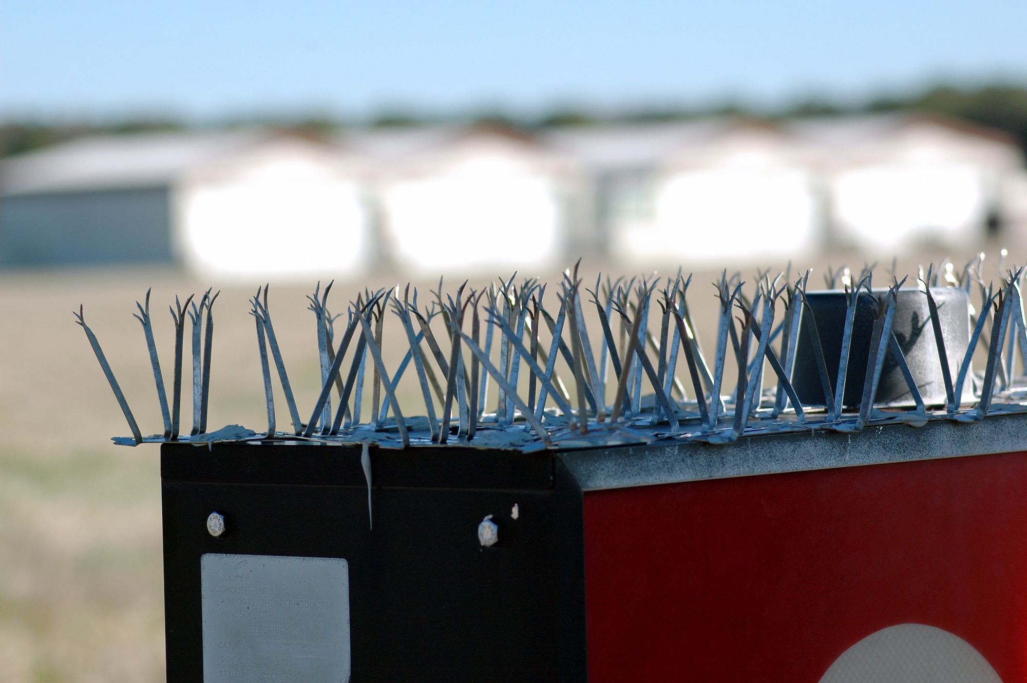 Spiny metal strips are tools are placed on any device where birds would perch, loof or roost near Langley Air Force Base, Va. They are placed by the Bird and Wildlife Aircraft Strike Hazard team to prevent bird strikes with aircraft. (U.S. Air Force photo) 
