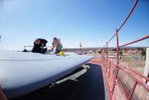 Technical Sgt. Shawn Connolly and Senior Airman Christopher Snodderley de-panel the t-tail of one of Westover's C-5's as part of the isochronical inspection process.